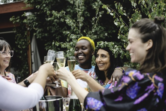 A couple toasting with their wedding guests